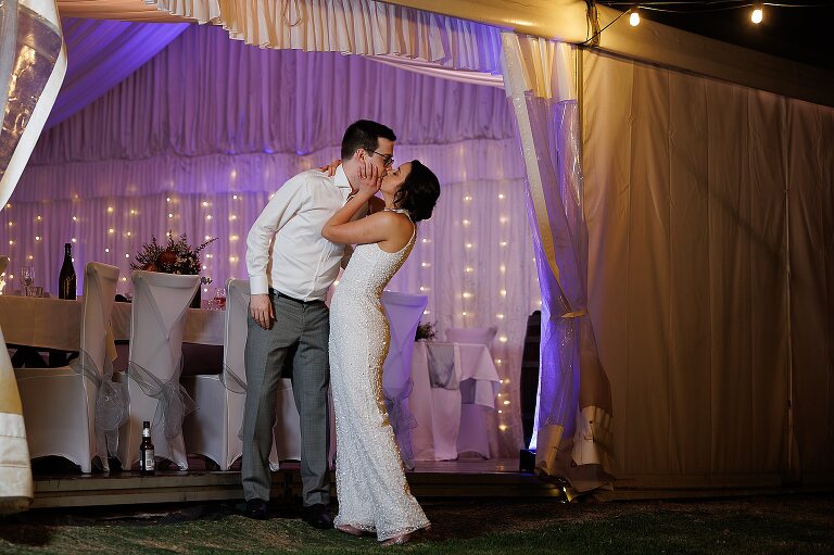 O'reilly's canungra valley vineyard wedding set up in marquee tent with bride and groom dancing at reception